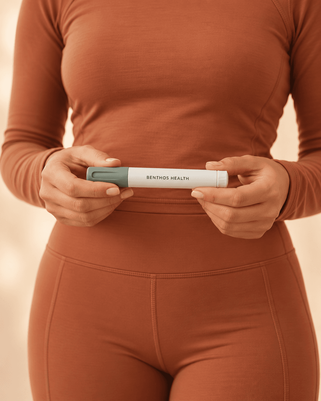 A woman holding a Benthos Health medication pen